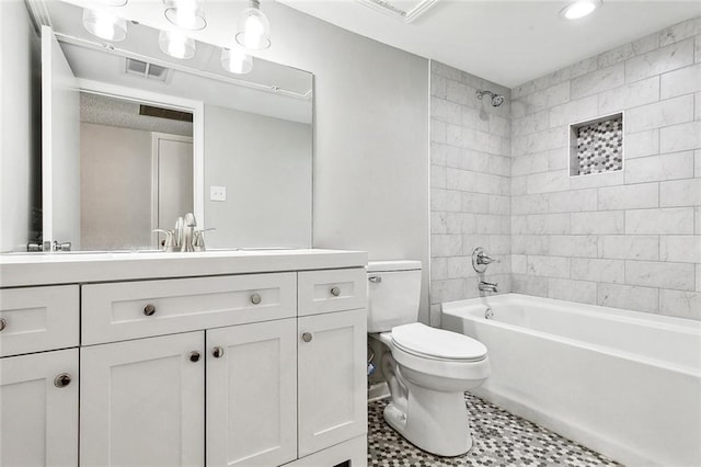 full bathroom featuring toilet, shower / bath combination, visible vents, and vanity