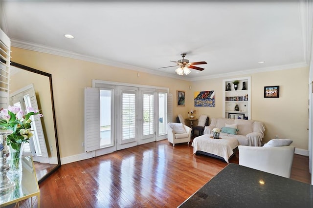 3408 Nashville Ave, New Orleans, LA 70125 - living room with built in features, french doors, a ceiling fan, baseboards, and wood finished floors