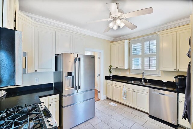 3408 Nashville Ave, New Orleans, LA 70125 - kitchen featuring a sink, appliances with stainless steel finishes, dark countertops, and ceiling fan