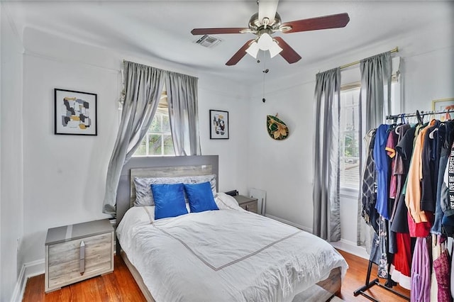 3408 Nashville Ave, New Orleans, LA 70125 - bedroom featuring visible vents, a ceiling fan, baseboards, and wood finished floors