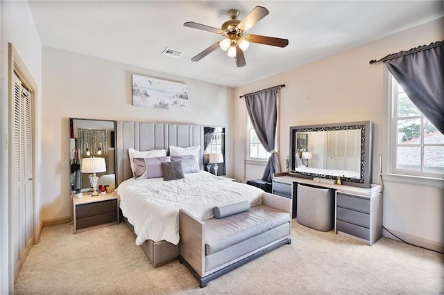 3408 Nashville Ave, New Orleans, LA 70125 - bedroom featuring light colored carpet, a ceiling fan, visible vents, and a closet