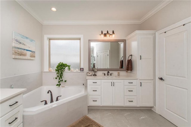 bathroom featuring vanity, recessed lighting, crown molding, and a garden tub