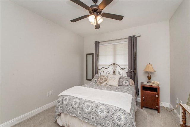 bedroom featuring carpet floors, a ceiling fan, and baseboards