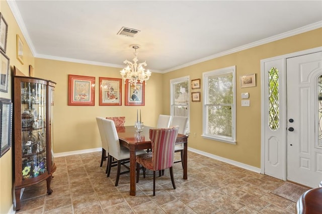 421 Oaklawn Dr, Metairie, LA 70005 - dining room with crown molding, a notable chandelier, baseboards, and visible vents