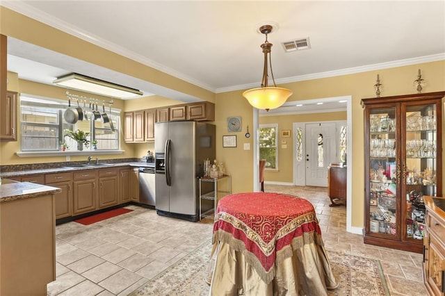 421 Oaklawn Dr, Metairie, LA 70005 - kitchen with a sink, stone tile flooring, visible vents, hanging light fixtures, and appliances with stainless steel finishes