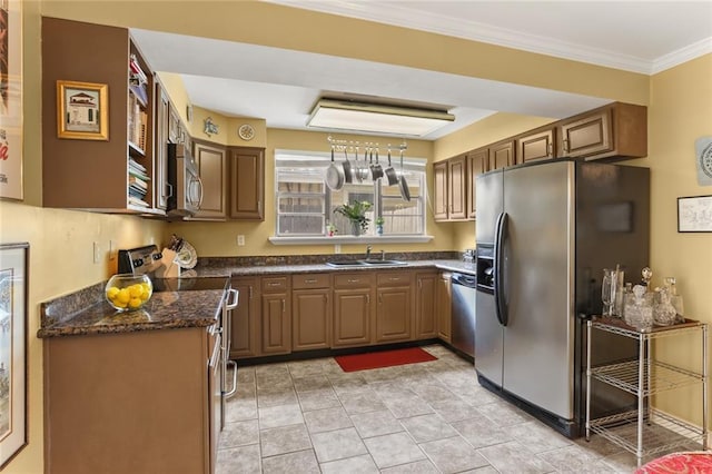 421 Oaklawn Dr, Metairie, LA 70005 - kitchen with a sink, crown molding, and appliances with stainless steel finishes