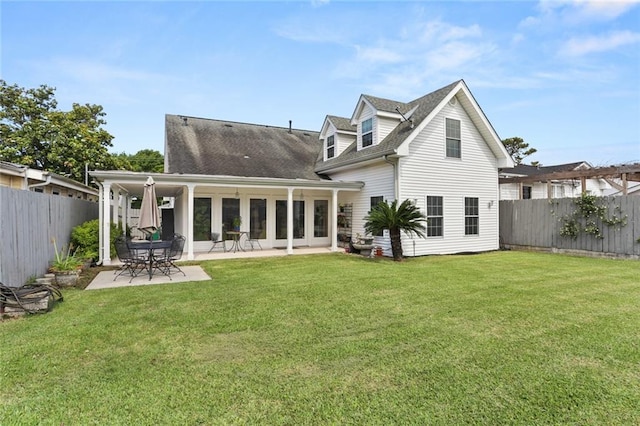 421 Oaklawn Dr, Metairie, LA 70005 - rear view of house featuring a fenced backyard, a patio area, and a lawn