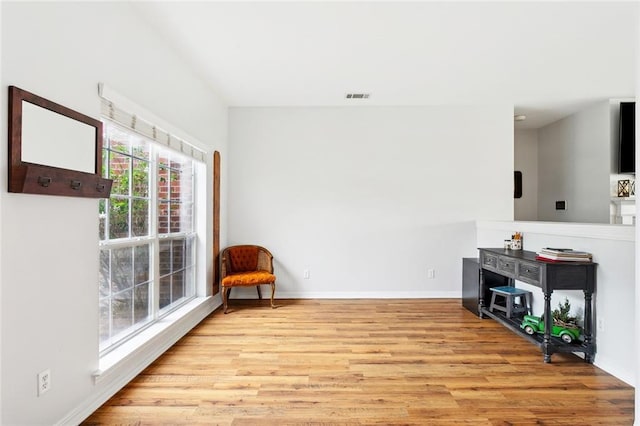 233 Arian Ln, Covington, LA 70433 - living area featuring light wood-style floors and baseboards