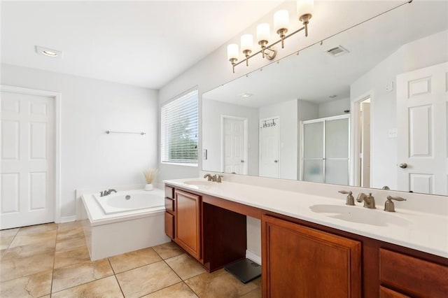 full bathroom featuring visible vents, a bath, a sink, a shower stall, and double vanity