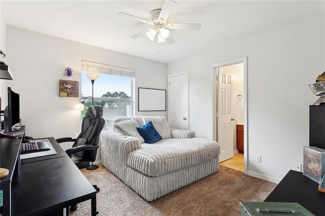 bedroom with carpet, ensuite bathroom, baseboards, and ceiling fan