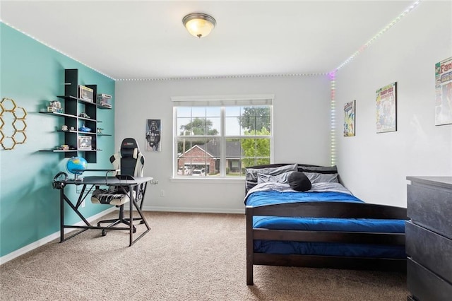 carpeted bedroom with baseboards