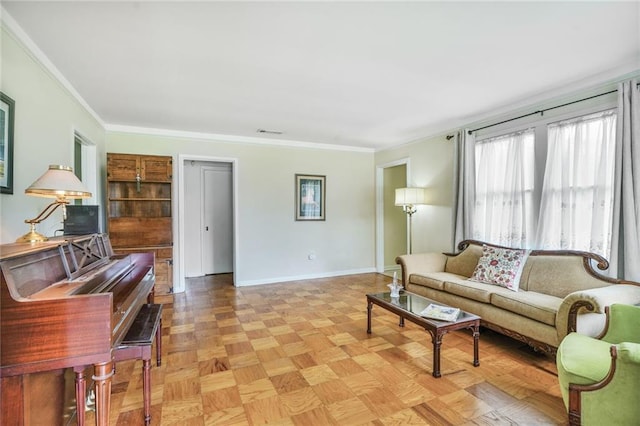 living room featuring baseboards, visible vents, and crown molding