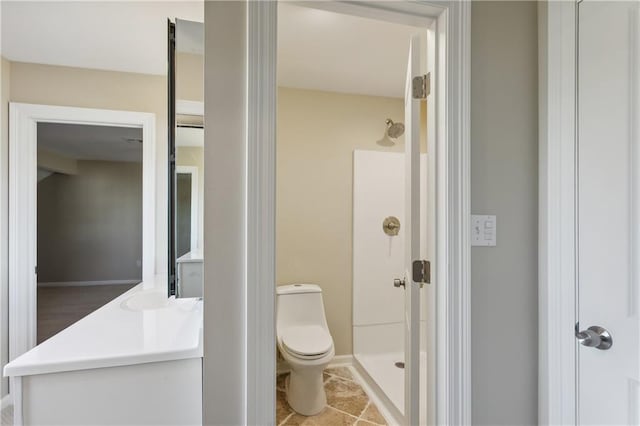 bathroom featuring toilet, a shower stall, tile patterned flooring, and vanity