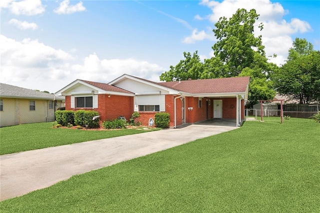 713 Lydia Ct, Marrero, LA 70072 - ranch-style home featuring fence, a carport, concrete driveway, a front yard, and brick siding