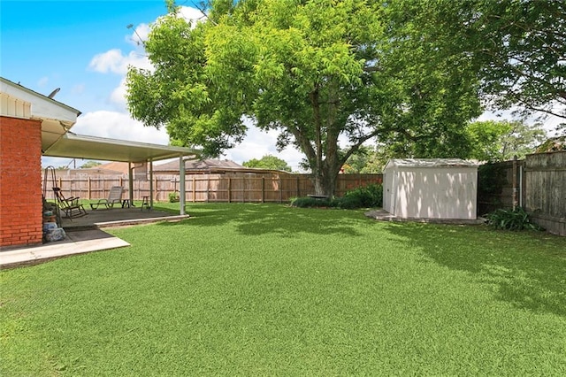 713 Lydia Ct, Marrero, LA 70072 - view of yard featuring a fenced backyard, a patio, a shed, and an outbuilding