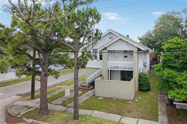3031 Jena St, New Orleans, LA 70125 - view of front of home with stairway, fence, and a balcony