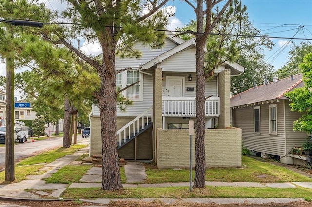 3031 Jena St, New Orleans, LA 70125 - view of front of house featuring a porch and stairs