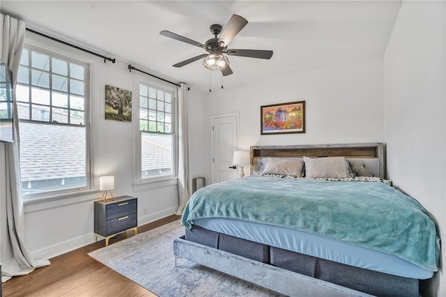 3031 Jena St, New Orleans, LA 70125 - bedroom with baseboards, a ceiling fan, and wood finished floors