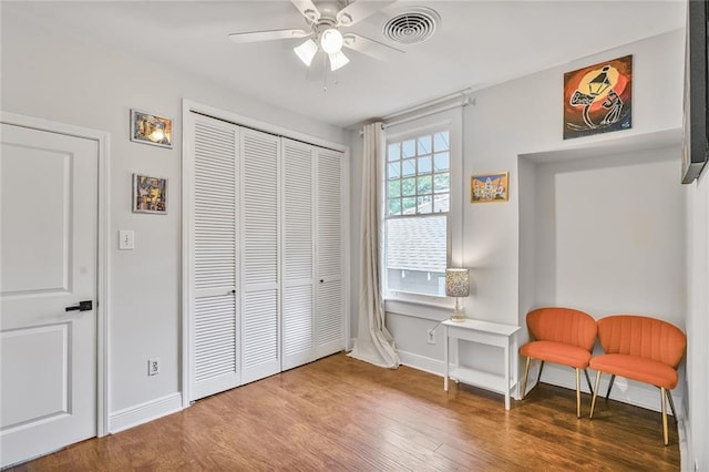 3031 Jena St, New Orleans, LA 70125 - sitting room featuring wood finished floors, visible vents, baseboards, and a ceiling fan