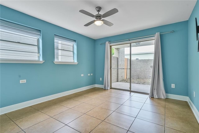 3031 Jena St, New Orleans, LA 70125 - spare room featuring baseboards, a ceiling fan, and light tile patterned floors