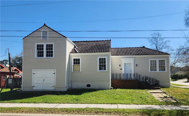 6417 Fleur De Lis Dr, New Orleans, LA 70124 - view of front of house with a tiled roof and a front yard