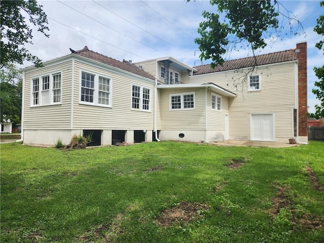 6417 Fleur De Lis Dr, New Orleans, LA 70124 - rear view of property featuring a lawn
