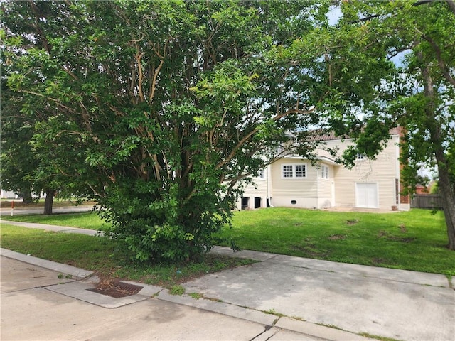 6417 Fleur De Lis Dr, New Orleans, LA 70124 - view of home's exterior featuring a lawn