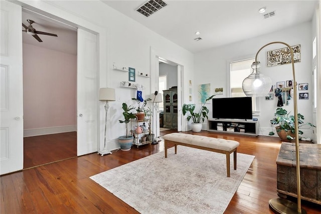 3605 Constance St, New Orleans, LA 70115 - living room with baseboards, hardwood / wood-style floors, a ceiling fan, and visible vents