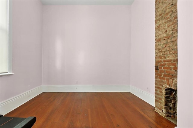 3605 Constance St, New Orleans, LA 70115 - unfurnished room featuring baseboards and hardwood / wood-style floors