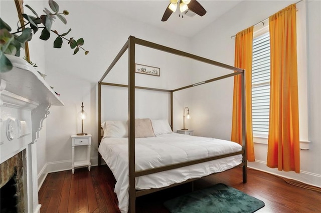 3605 Constance St, New Orleans, LA 70115 - bedroom with a fireplace, ceiling fan, hardwood / wood-style flooring, and baseboards