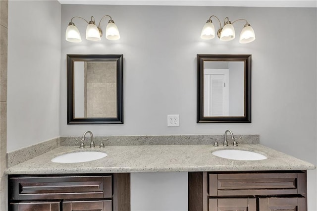 full bath featuring double vanity and a sink