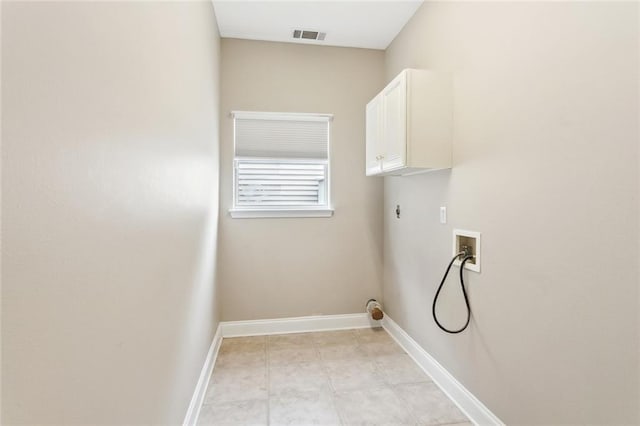 laundry area with cabinet space, washer hookup, hookup for an electric dryer, visible vents, and baseboards