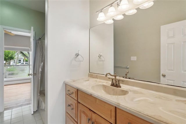 bathroom featuring vanity, curtained shower, and tile patterned flooring