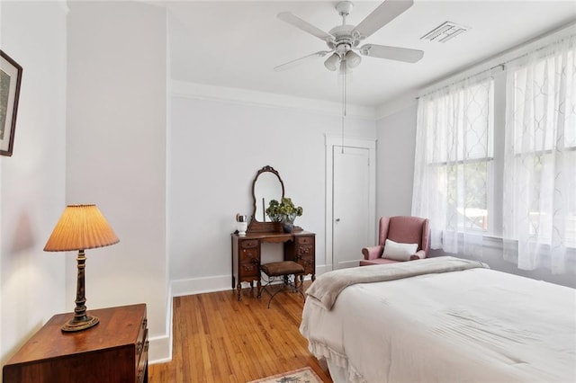 504 N Labarre Rd, Metairie, LA 70001 - bedroom with light wood-style flooring, baseboards, a ceiling fan, and visible vents