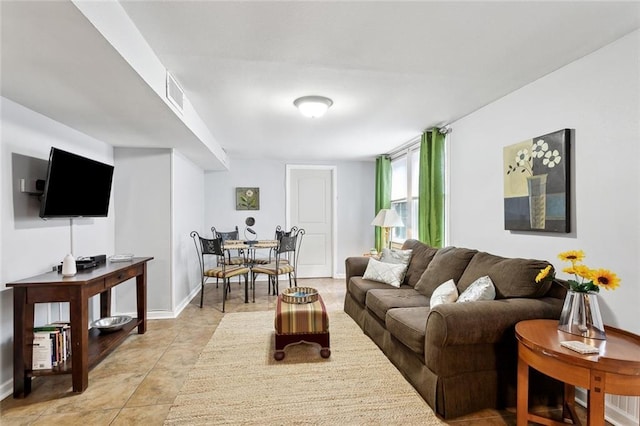 504 N Labarre Rd, Metairie, LA 70001 - living area with baseboards, light tile patterned floors, and visible vents