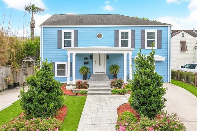 5512 S Tonti St, New Orleans, LA 70125 - view of front of home with a porch, driveway, and fence