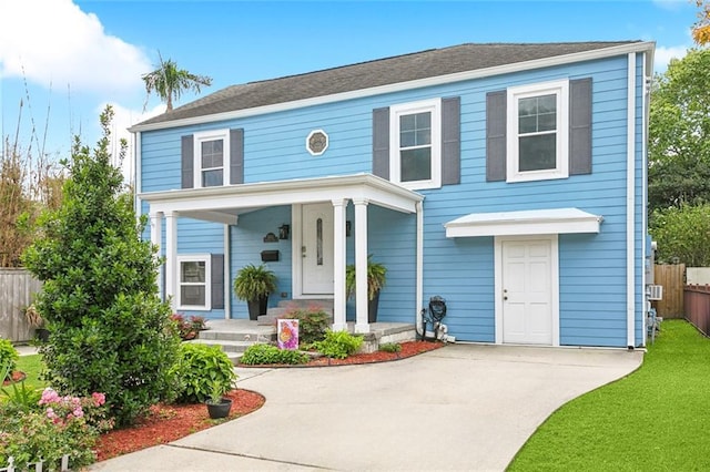 5512 S Tonti St, New Orleans, LA 70125 - colonial inspired home with driveway, covered porch, and fence