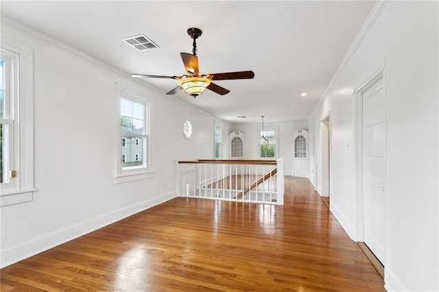 5512 S Tonti St, New Orleans, LA 70125 - unfurnished room featuring ceiling fan, crown molding, visible vents, and wood finished floors
