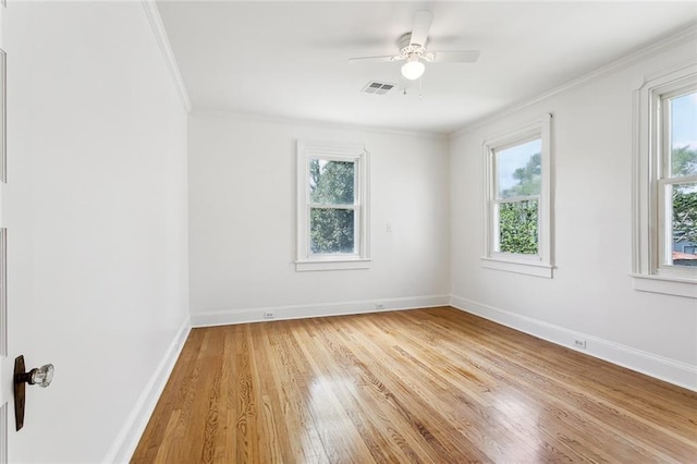 5512 S Tonti St, New Orleans, LA 70125 - unfurnished room with light wood-style flooring, a wealth of natural light, baseboards, and visible vents