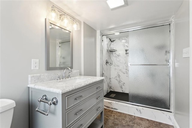 5512 S Tonti St, New Orleans, LA 70125 - full bathroom with toilet, a marble finish shower, and vanity