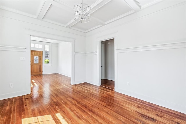 2113 Leonidas St, New Orleans, LA 70118 - empty room with coffered ceiling, a chandelier, wood-type flooring, and beamed ceiling