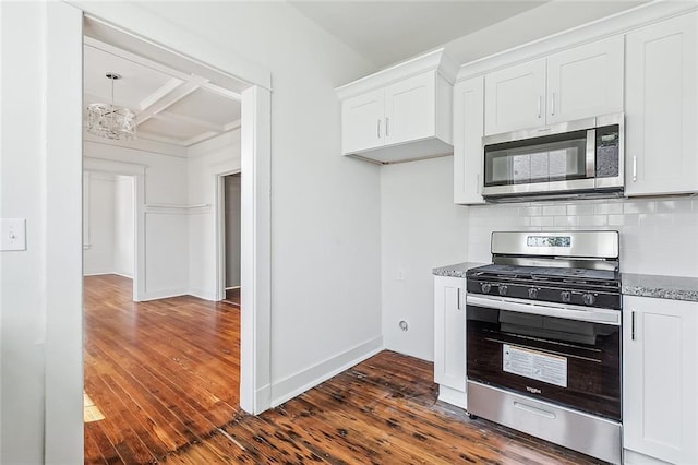 2113 Leonidas St, New Orleans, LA 70118 - kitchen featuring appliances with stainless steel finishes, dark wood-style floors, stone counters, backsplash, and coffered ceiling