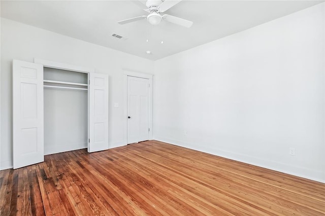 2113 Leonidas St, New Orleans, LA 70118 - unfurnished bedroom featuring wood finished floors and a ceiling fan