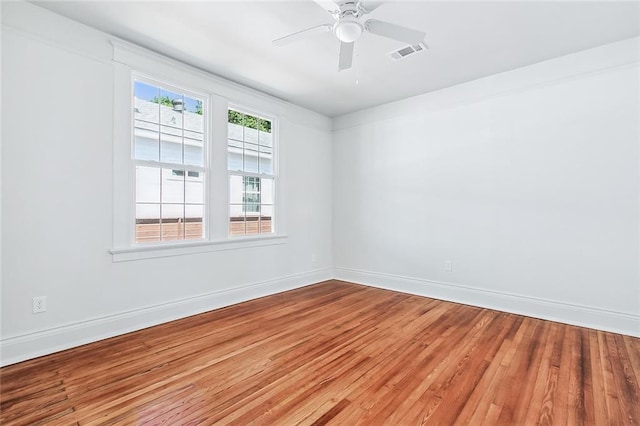 2113 Leonidas St, New Orleans, LA 70118 - spare room with wood finished floors and a ceiling fan