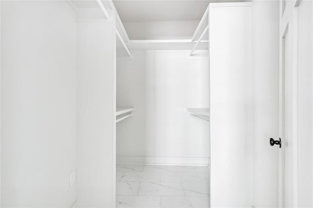 2113 Leonidas St, New Orleans, LA 70118 - walk in closet featuring marble look tiles