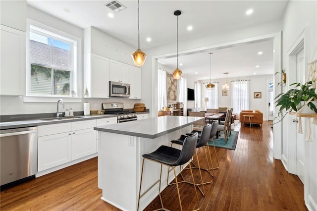 223 S White St, New Orleans, LA 70119 - kitchen with a wealth of natural light, appliances with stainless steel finishes, visible vents, and a sink