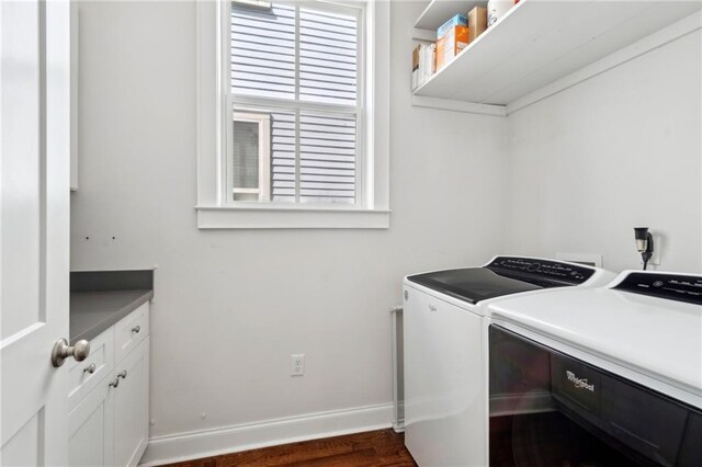 223 S White St, New Orleans, LA 70119 - washroom with washer and clothes dryer, cabinet space, baseboards, and dark wood finished floors
