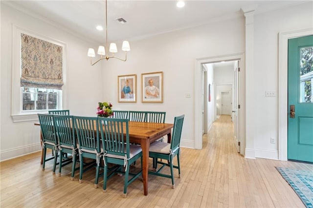 dining room with crown molding, baseboards, a chandelier, light wood-style flooring, and recessed lighting