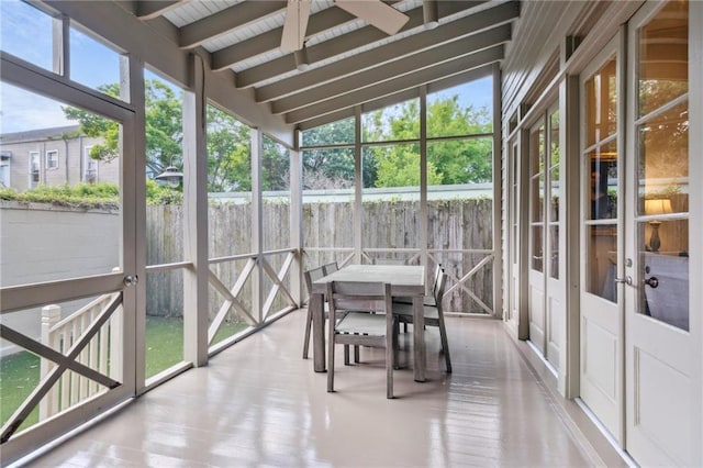 sunroom / solarium with outdoor dining space, a ceiling fan, and french doors