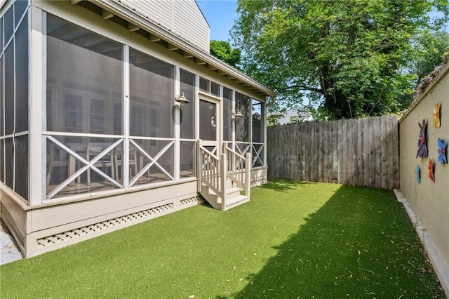 view of yard with a sunroom